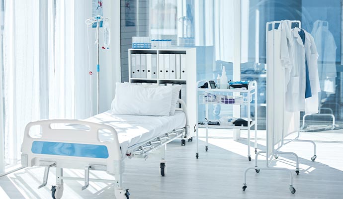 Clean hospital room with bed