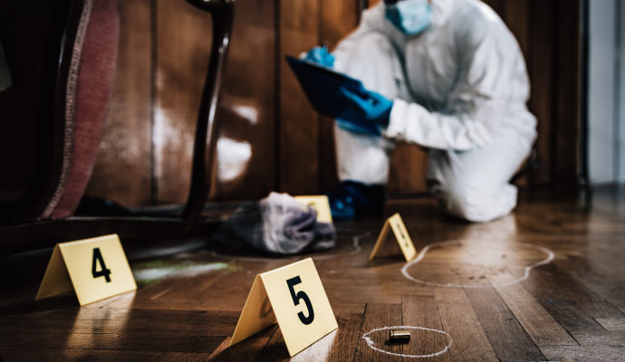 an individual is performing a biohazard cleanup