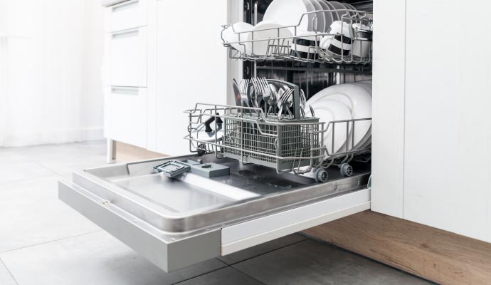 Clean dishwasher filled with different types of dishes