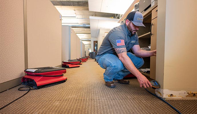 Water damage cleanup using professional restoration equipment.