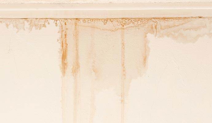 Wall surface showing visible water stain from roof leak